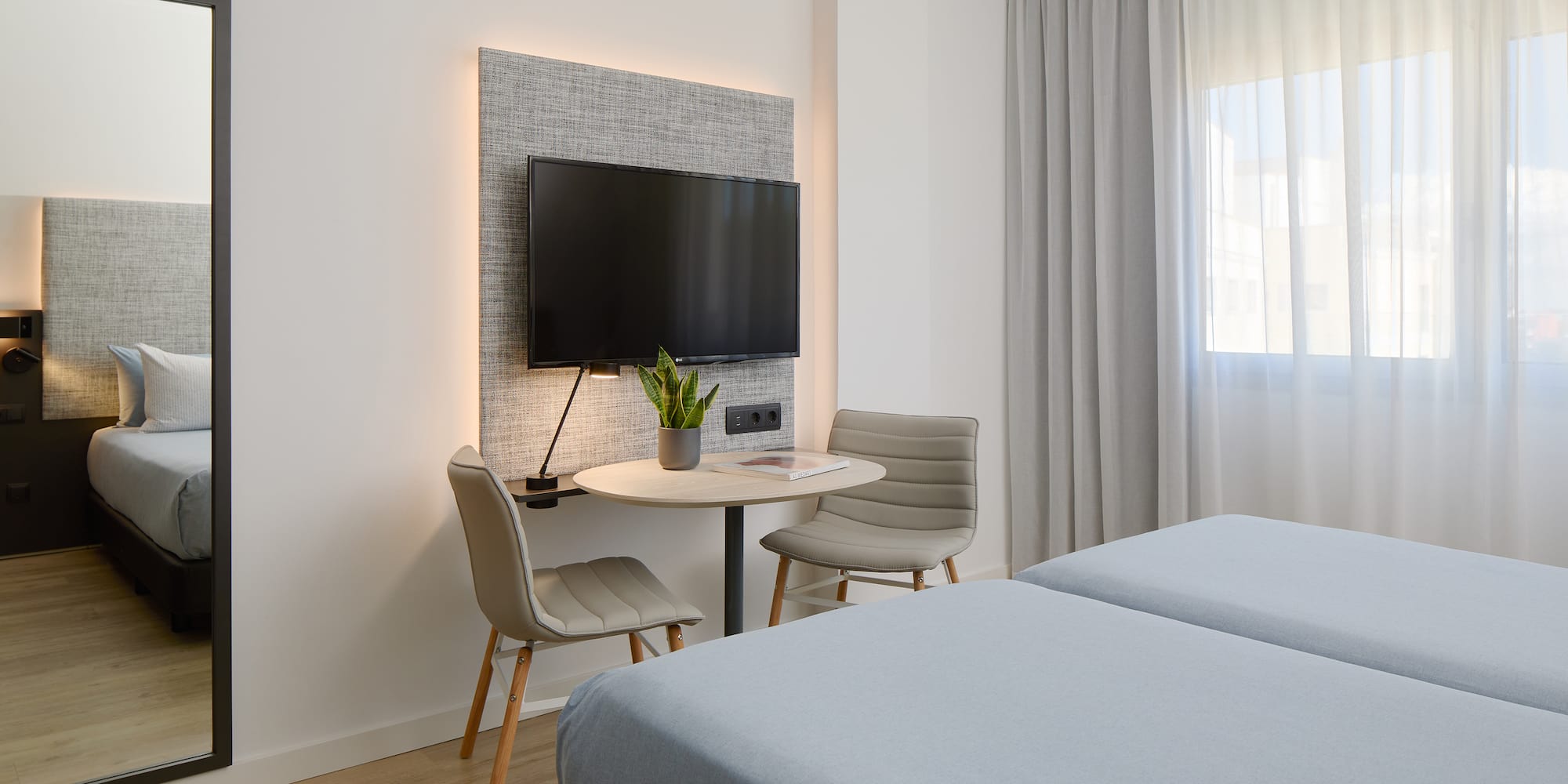 a room with a tv and a table