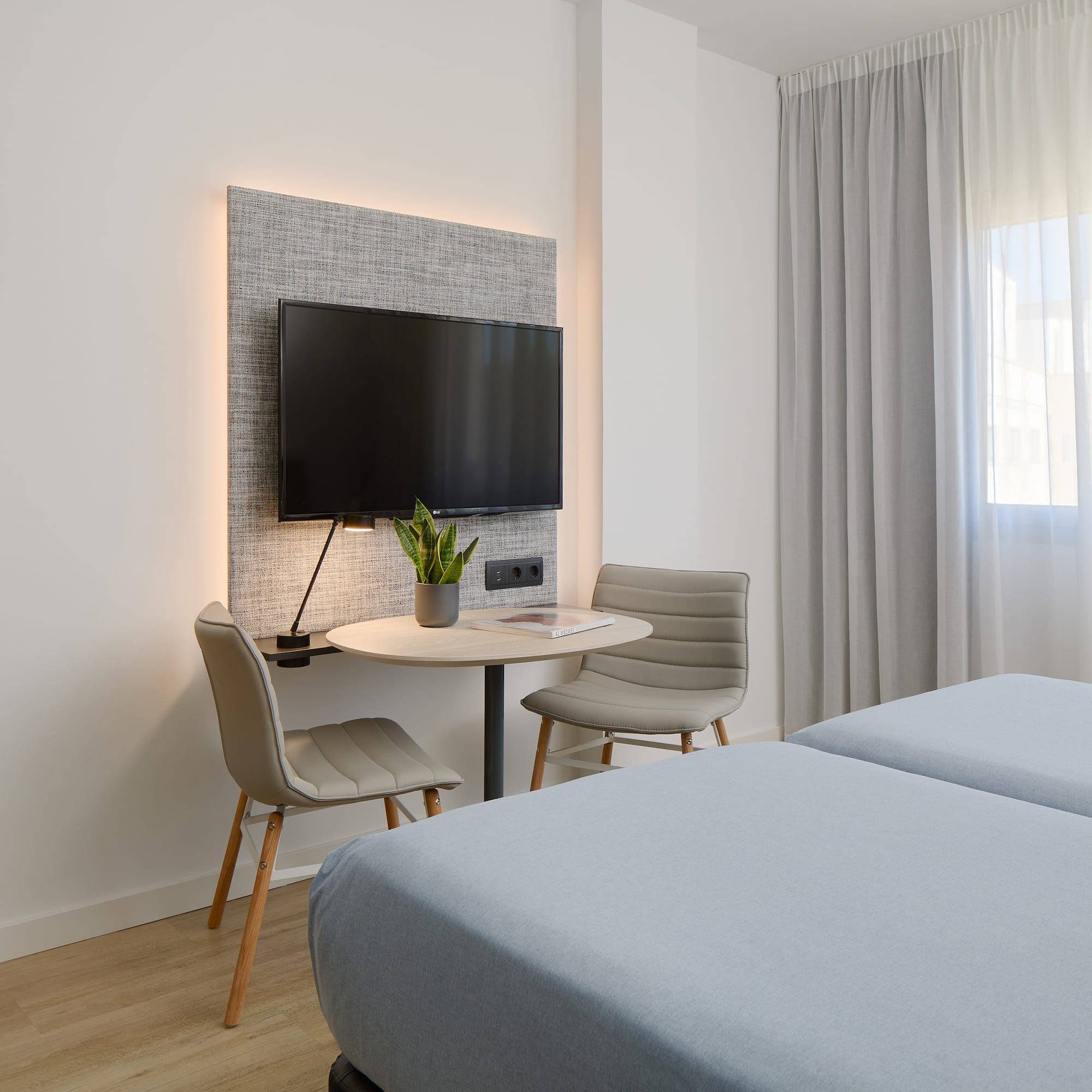 a room with a tv and a table