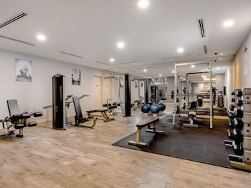 a large room with exercise equipment
