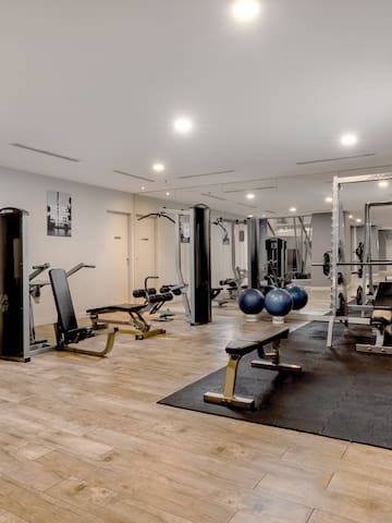 a large room with exercise equipment