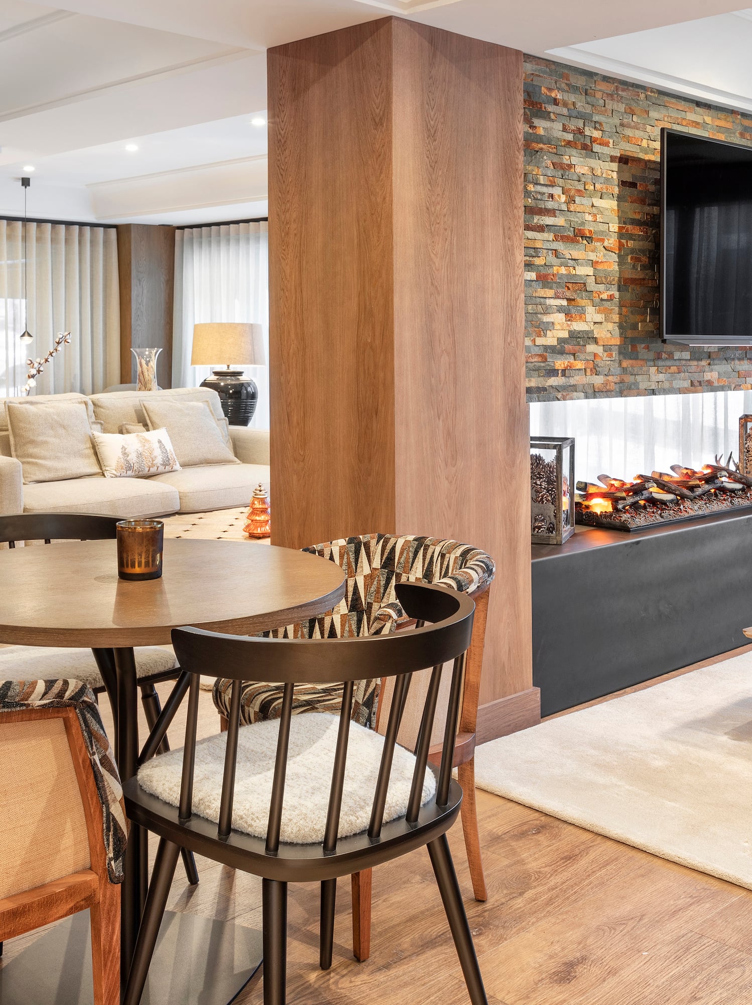 a living room with a fireplace and a table