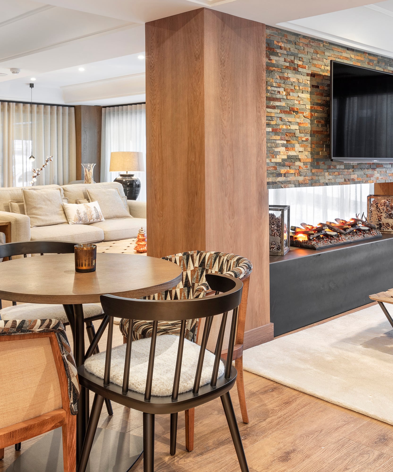 a living room with a fireplace and a table