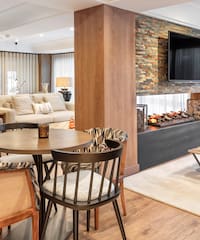 a living room with a fireplace and a table