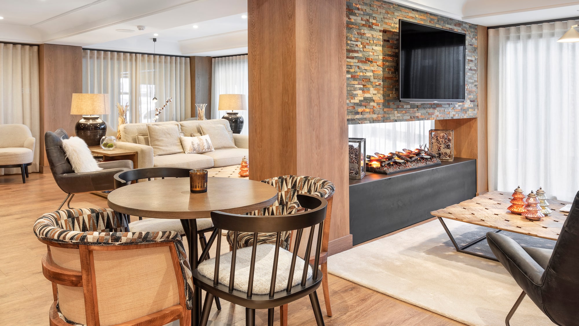 a living room with a fireplace and a table