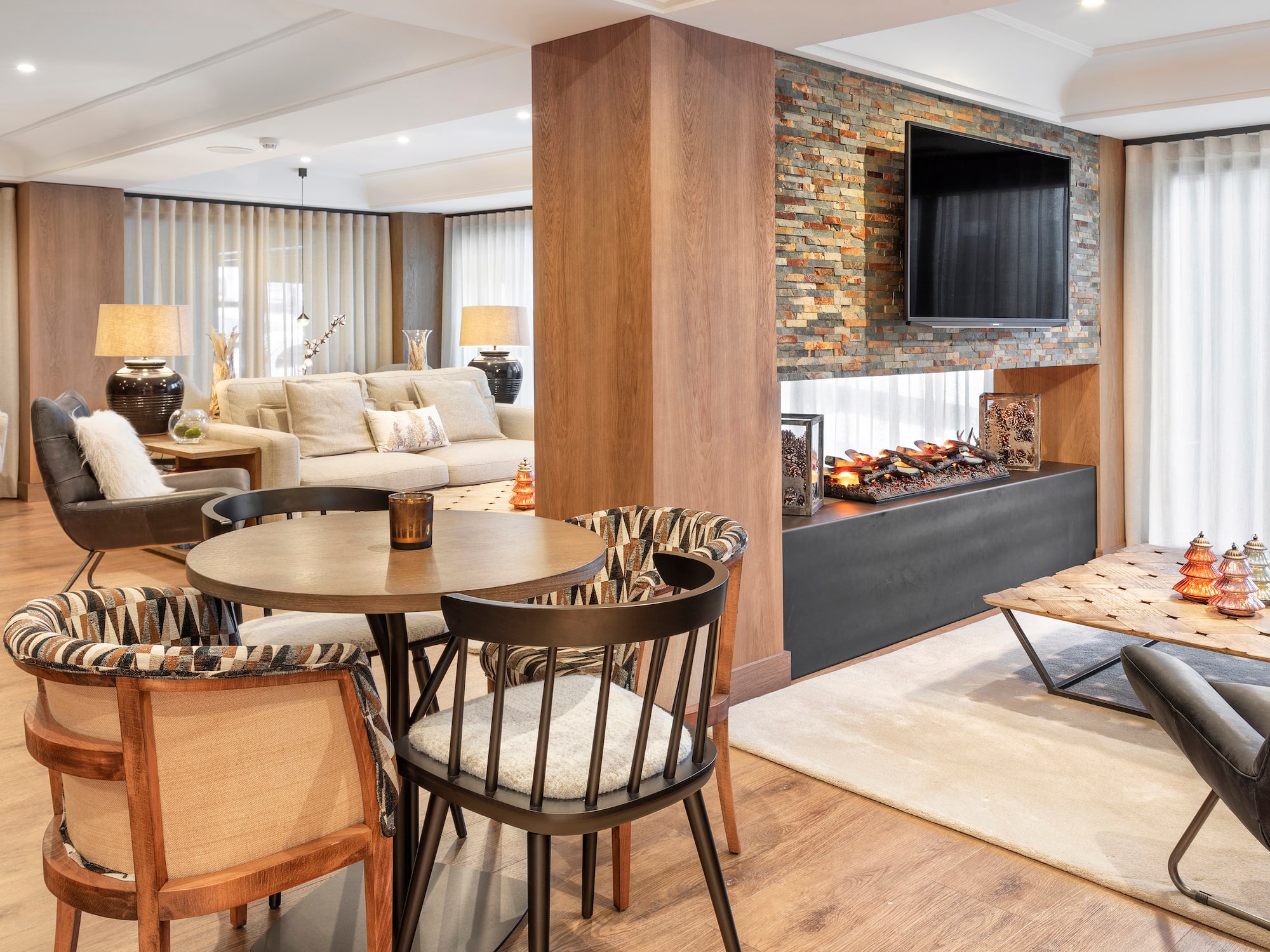 a living room with a fireplace and a table