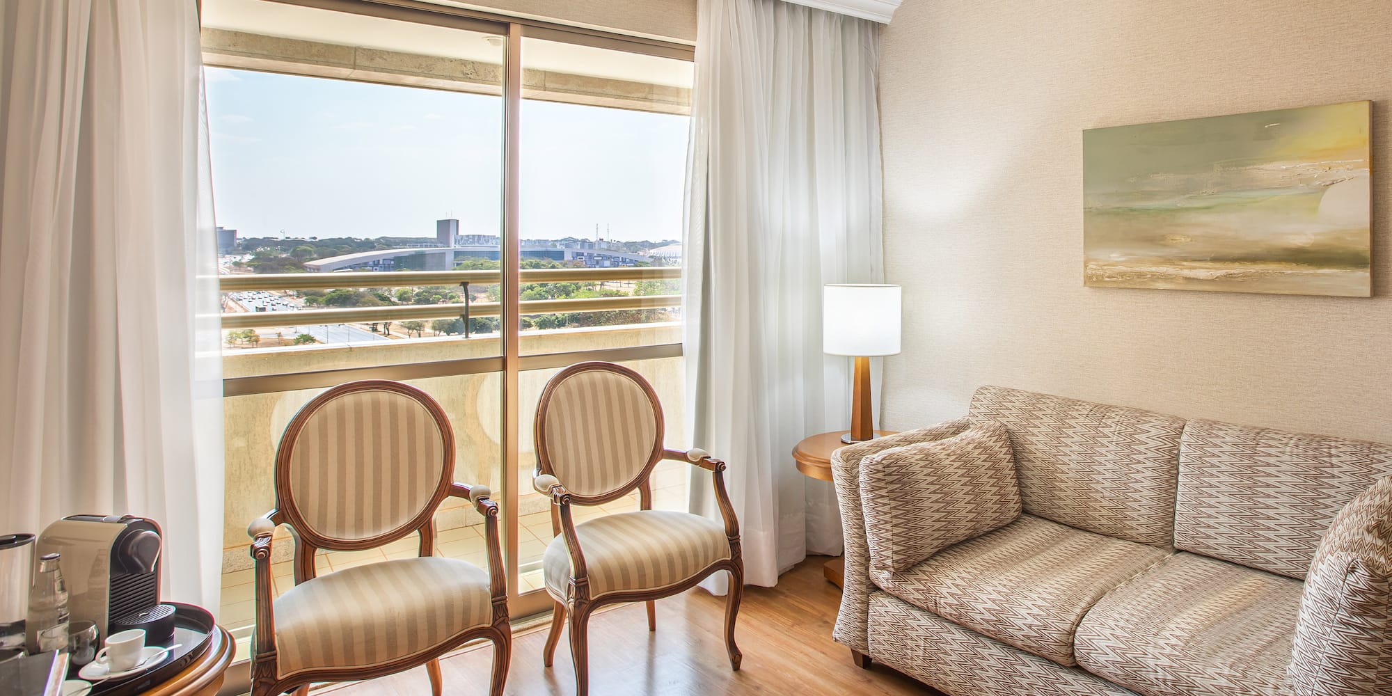 a living room with a couch and chairs