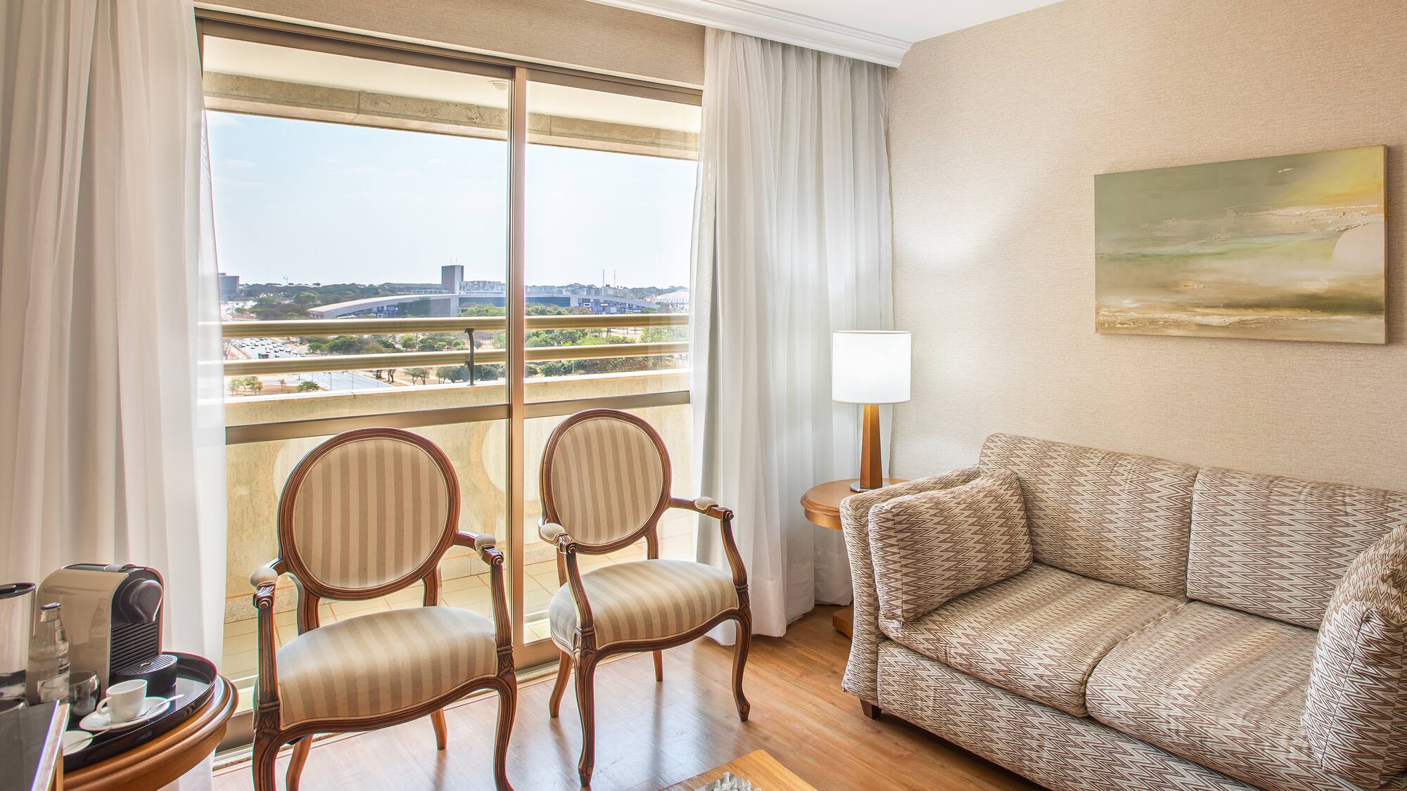 a living room with a couch and chairs