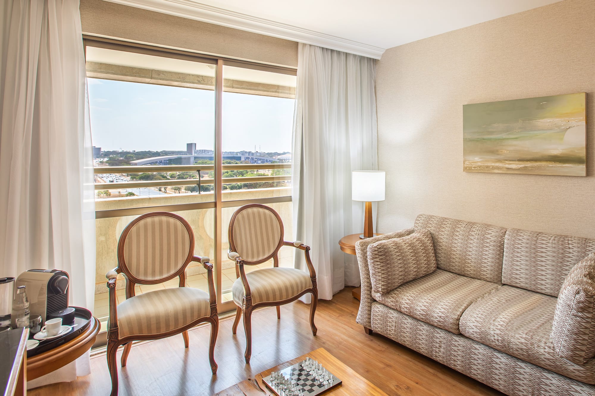 a living room with a couch and chairs