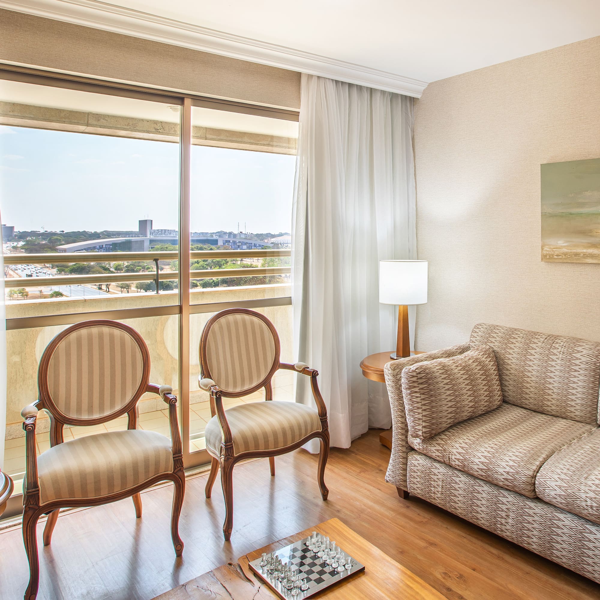 a living room with a couch and chairs