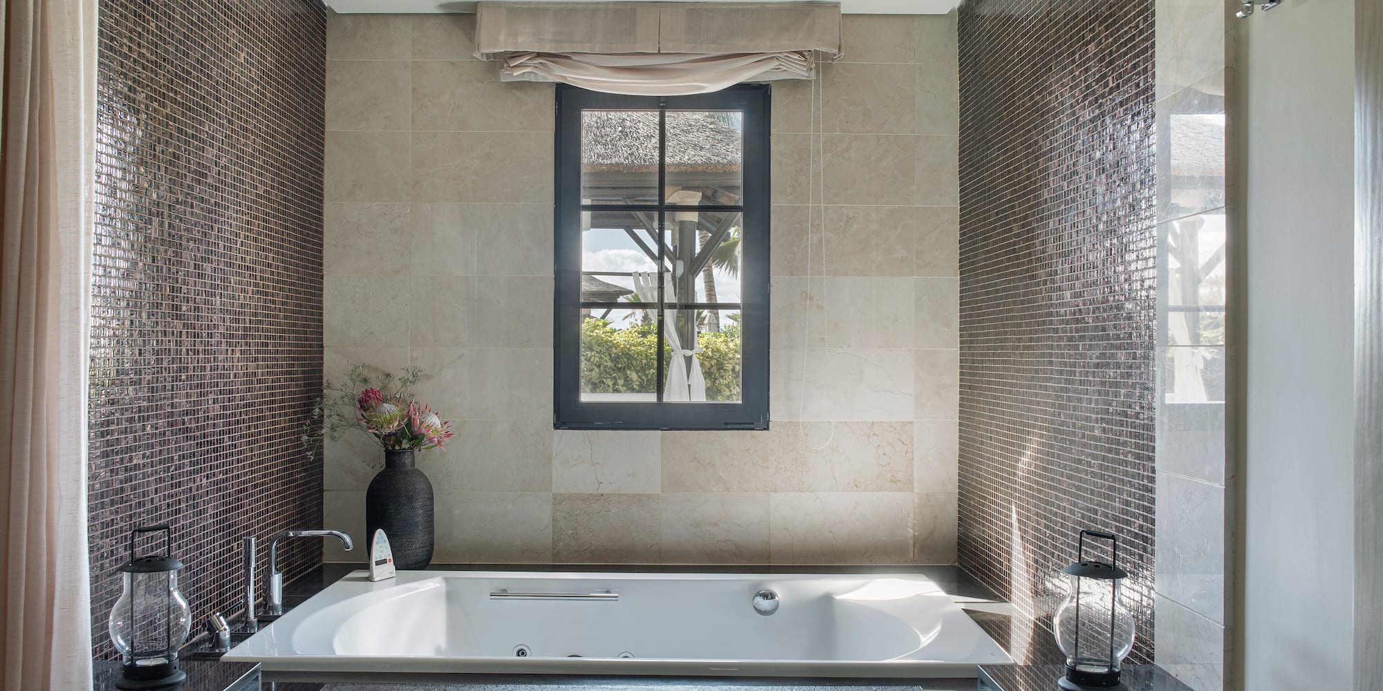a bathroom with a tub and a window
