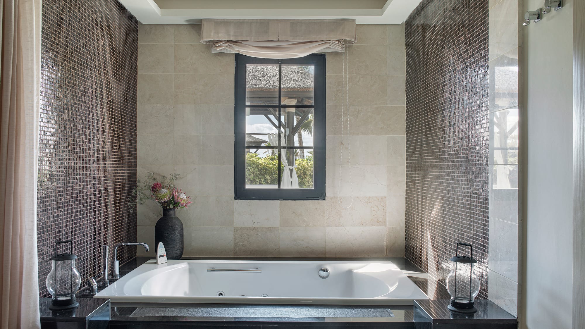 a bathroom with a tub and a window