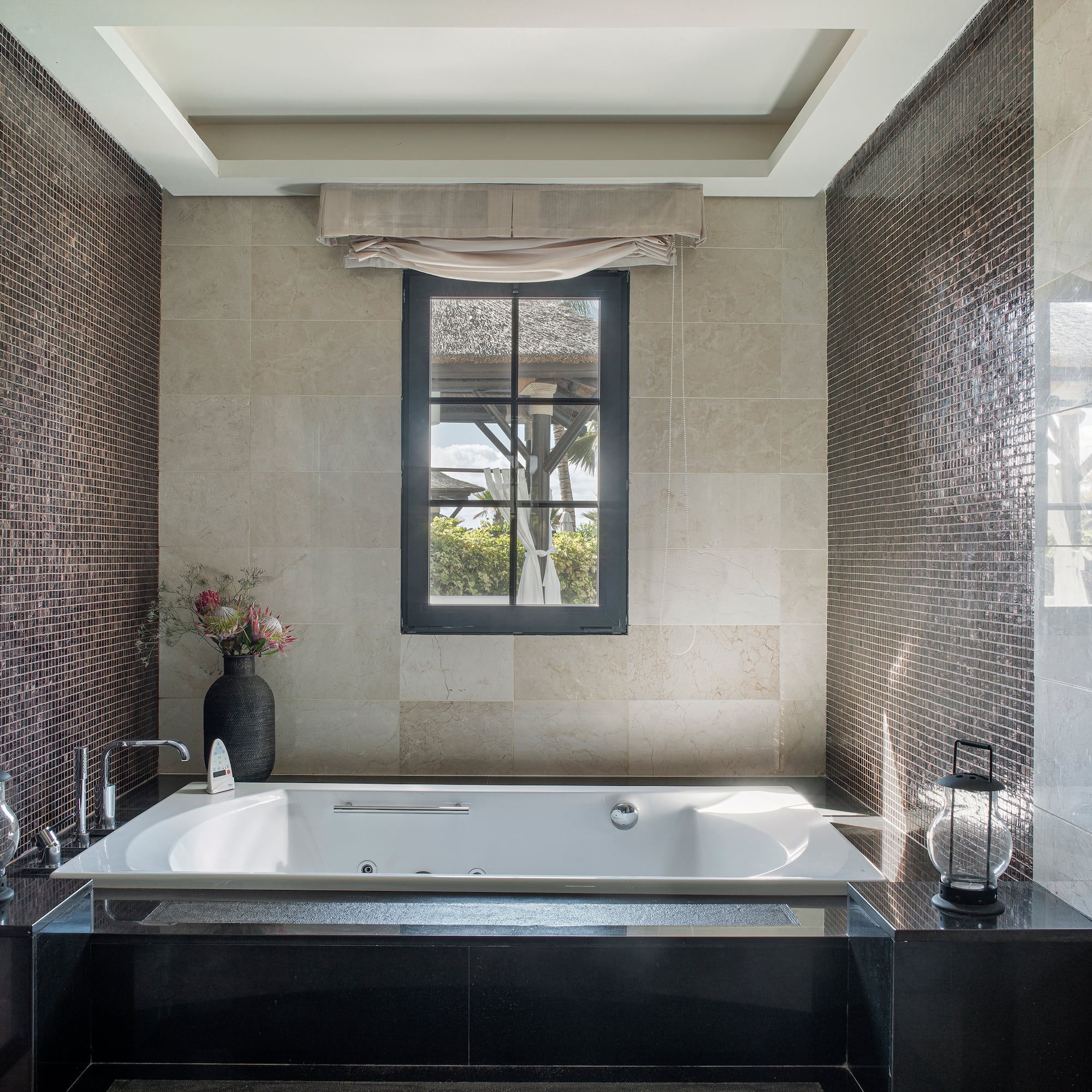 a bathroom with a tub and a window
