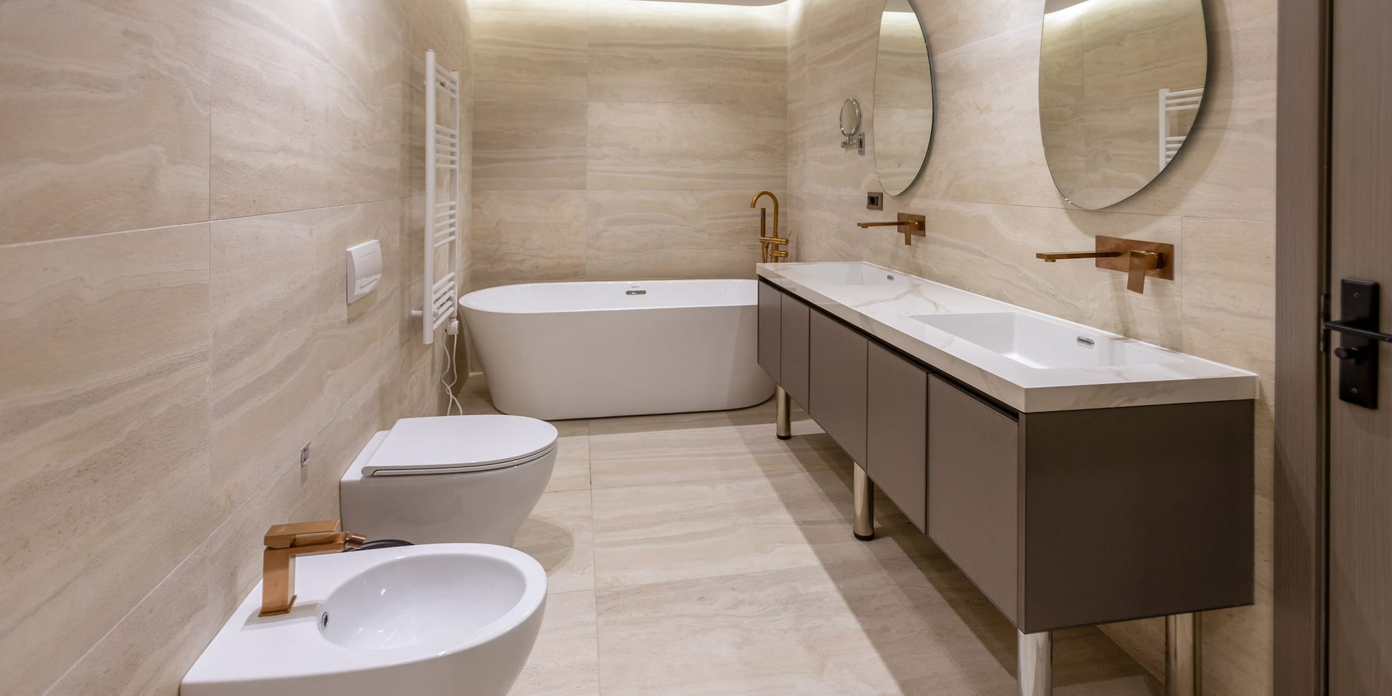 a bathroom with a tub toilet and sink