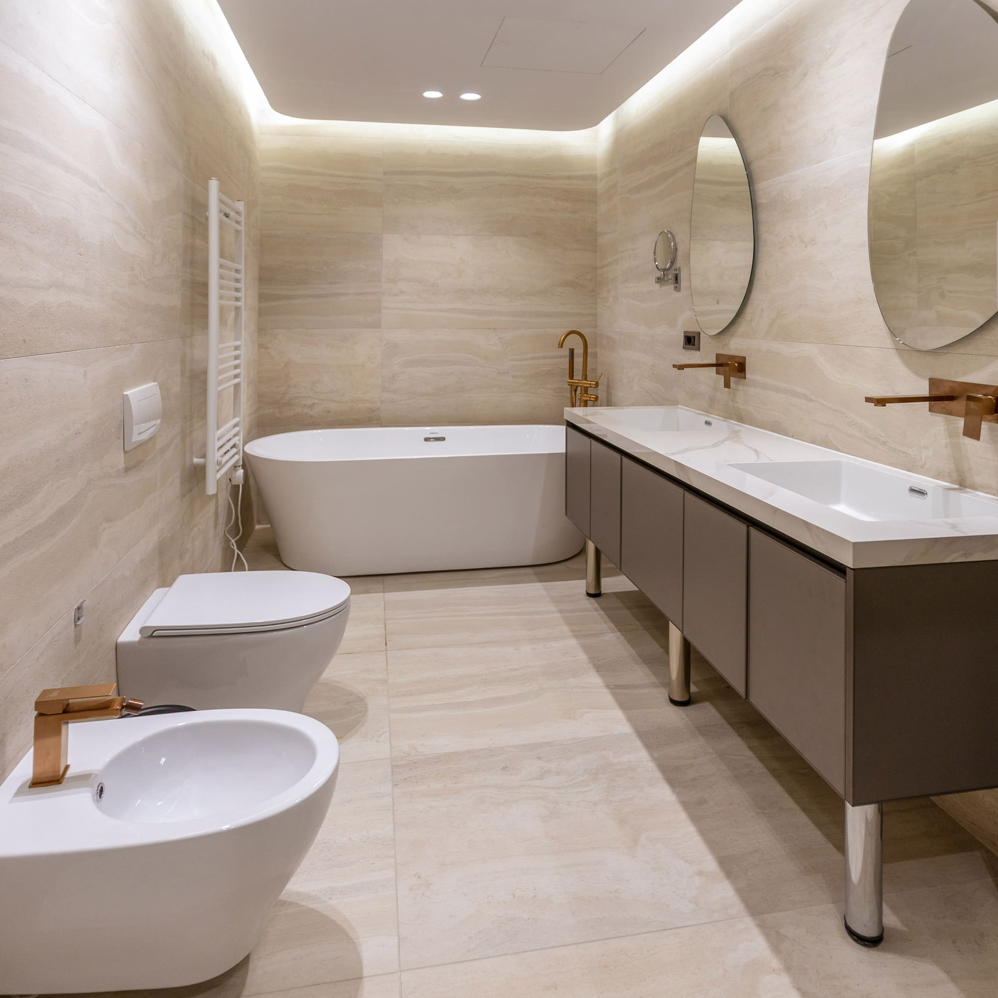 a bathroom with a tub toilet and sink