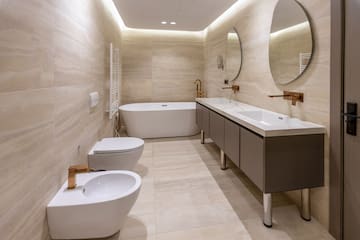 a bathroom with a tub toilet and sink