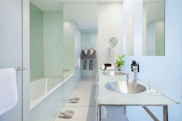 a bathroom with a bathtub and sink