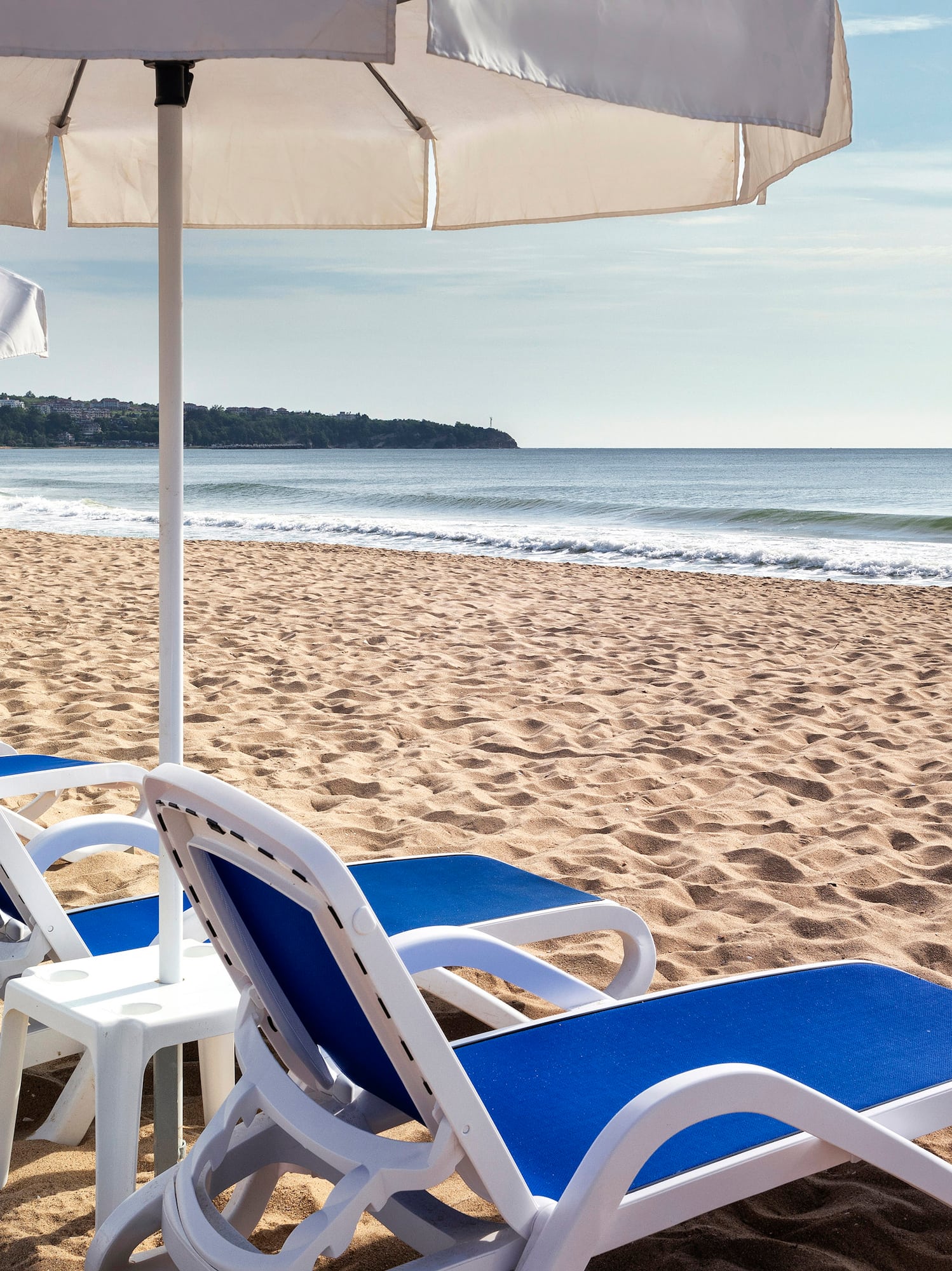 chairs and umbrellas on a beach