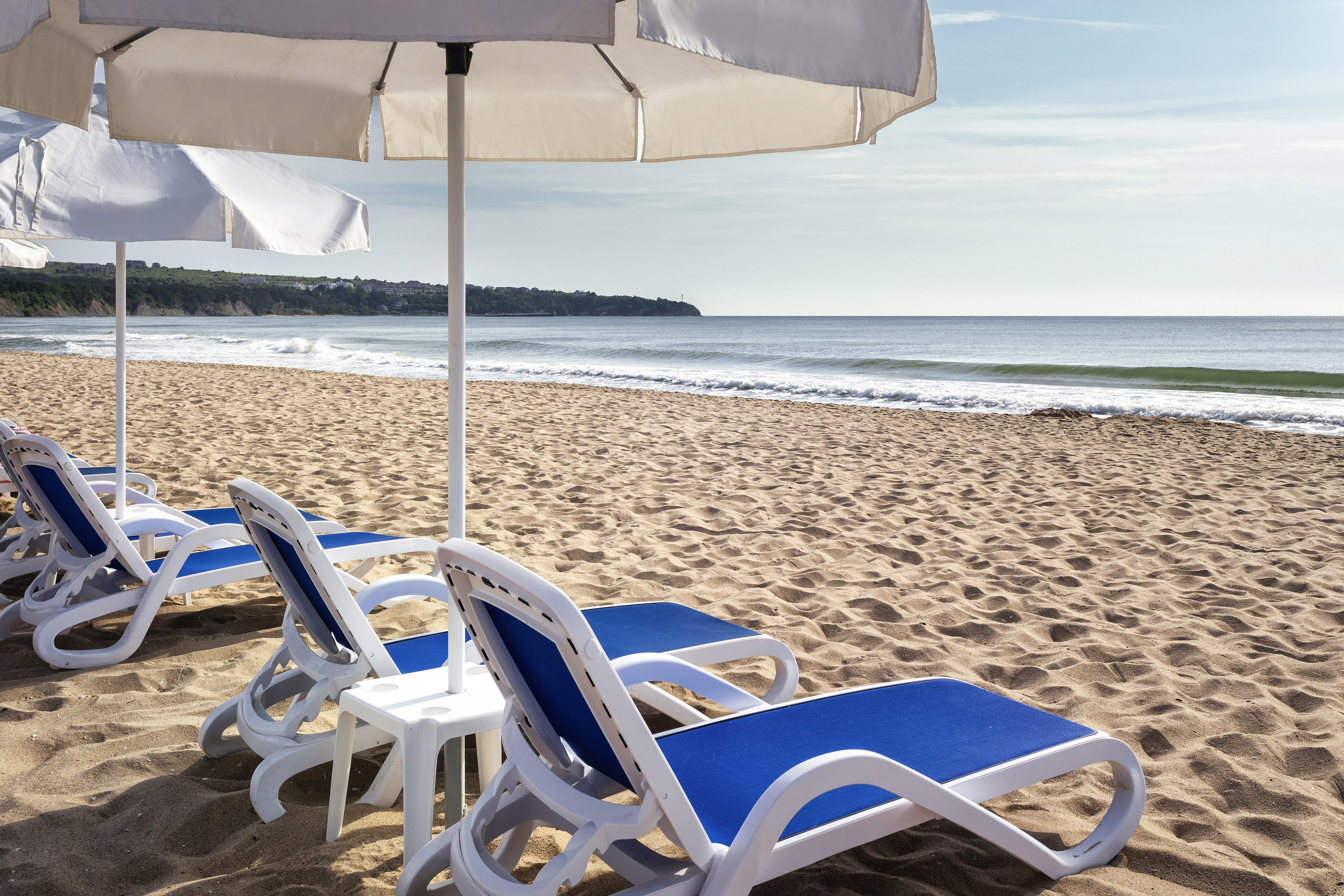 chairs and umbrellas on a beach