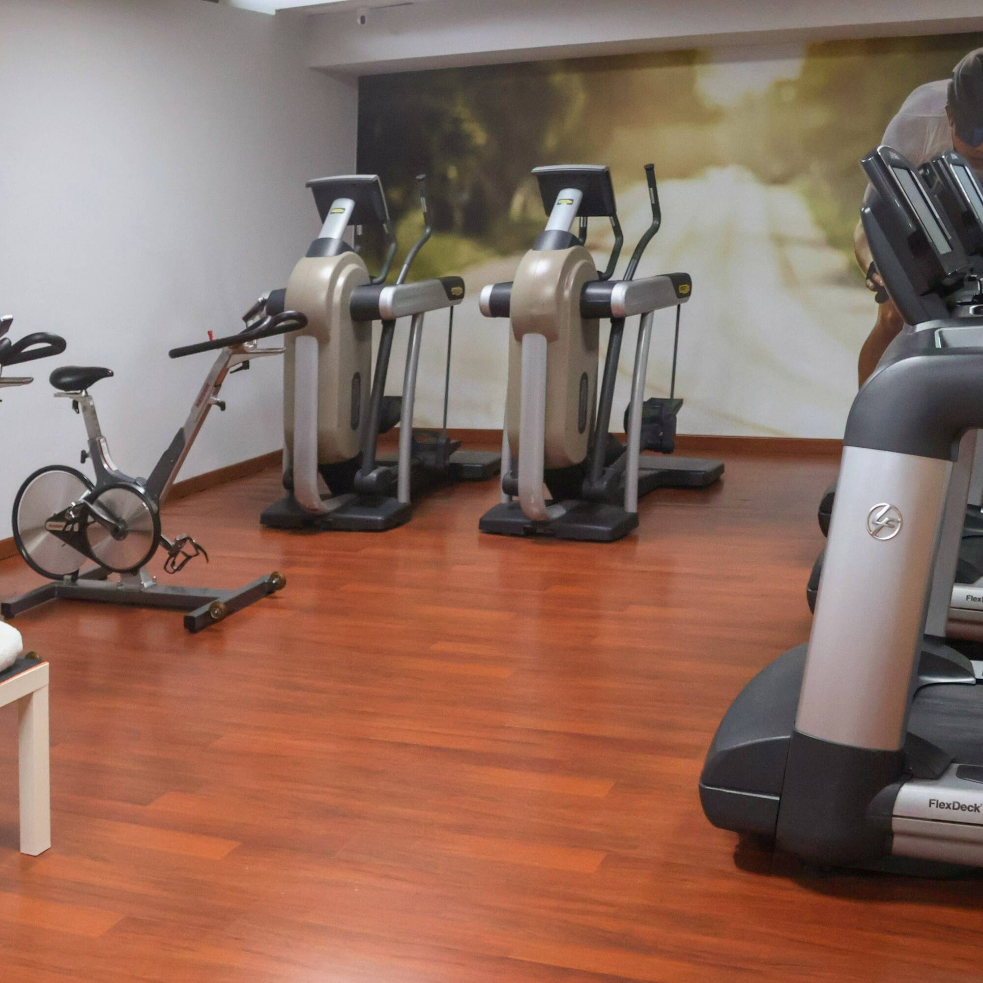 a room with exercise bikes and exercise machines