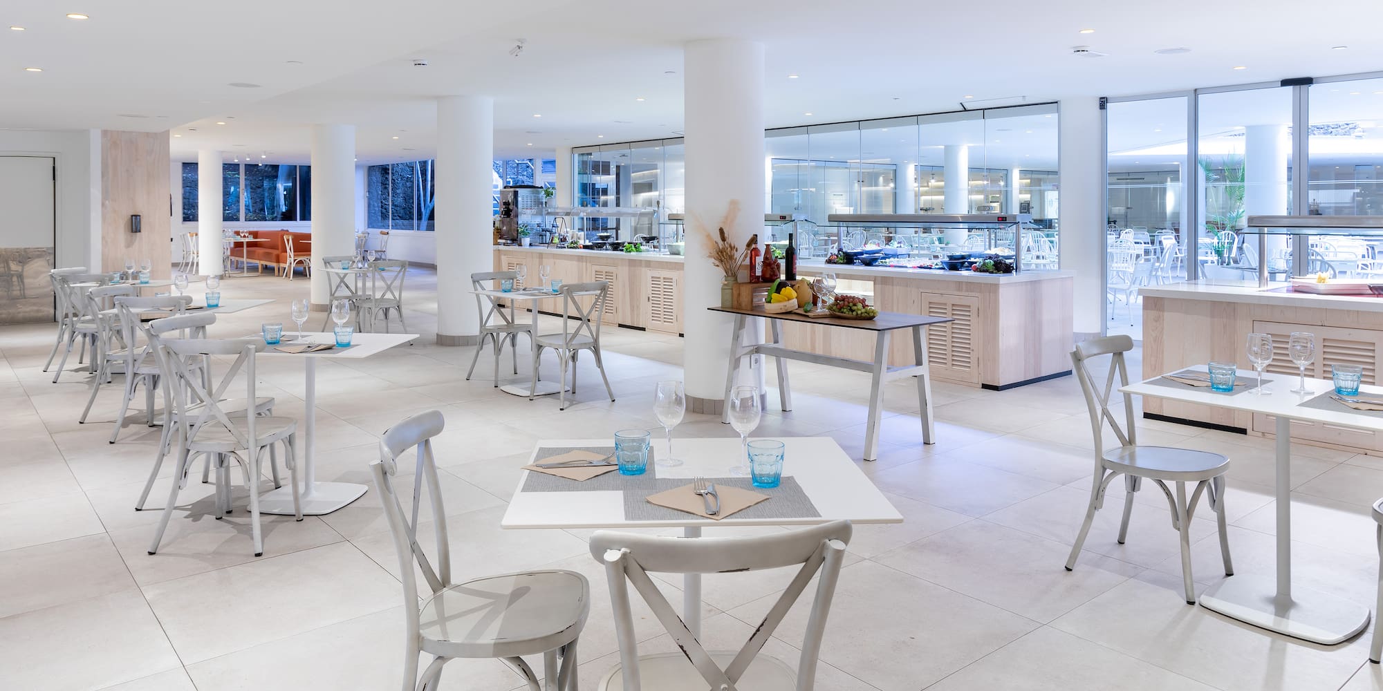 a restaurant with tables and chairs