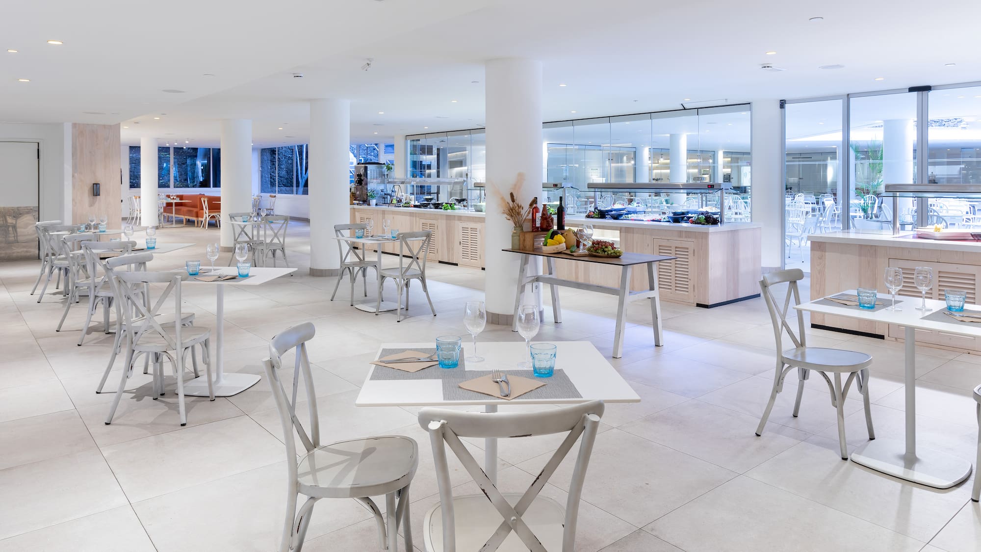 a restaurant with tables and chairs