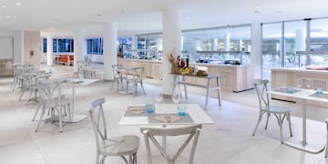 a restaurant with tables and chairs