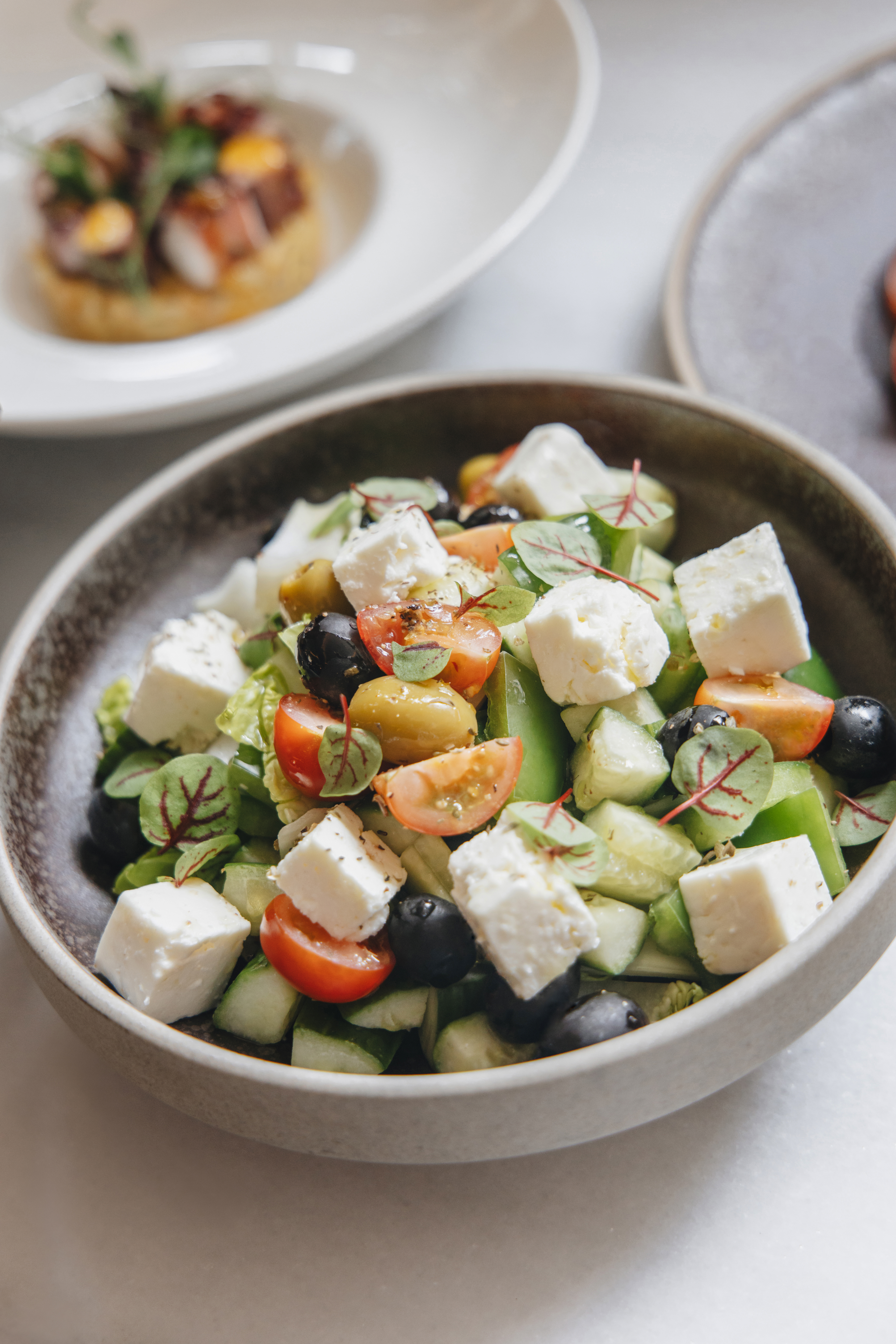 Greek salad with feta, black and green olives, tomatoes, cucumber.