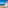 Balcony view of Benidorm beach, blue ocean, palm trees, and modern building.