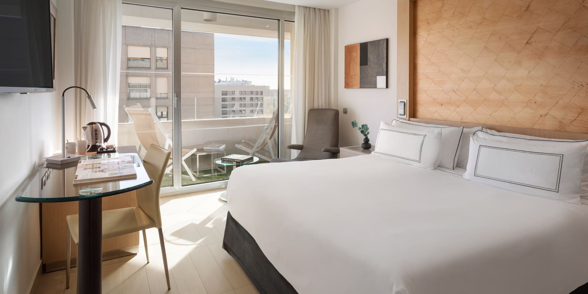 a bedroom with a bed and a desk