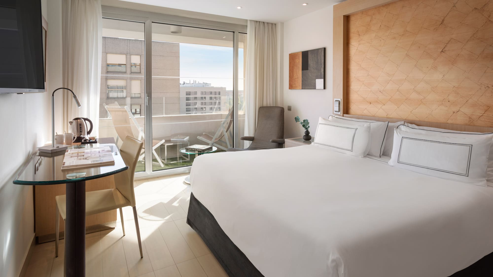 a bedroom with a bed and a desk