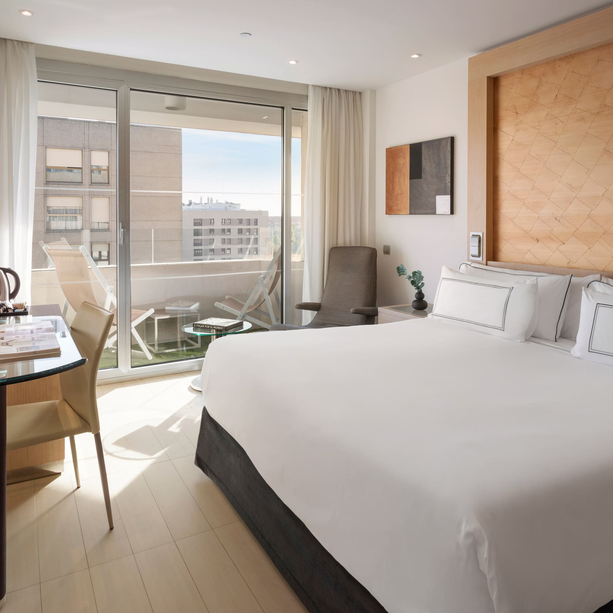 a bedroom with a bed and a desk