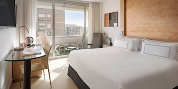 a bedroom with a bed and a desk