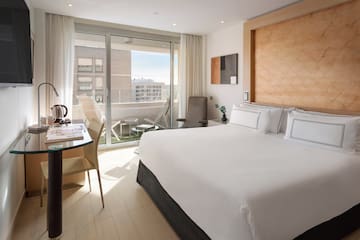 a bedroom with a bed and a desk