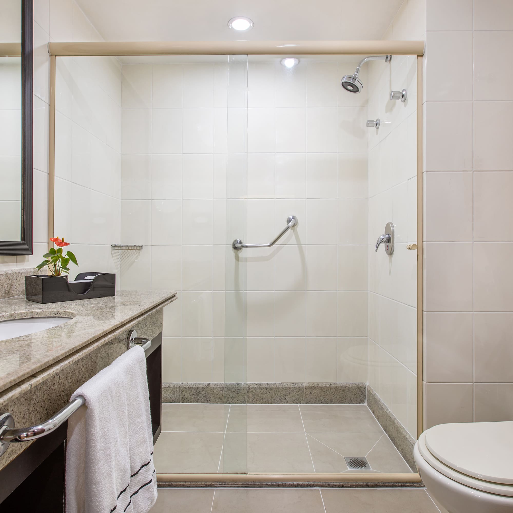 a bathroom with a shower and sink