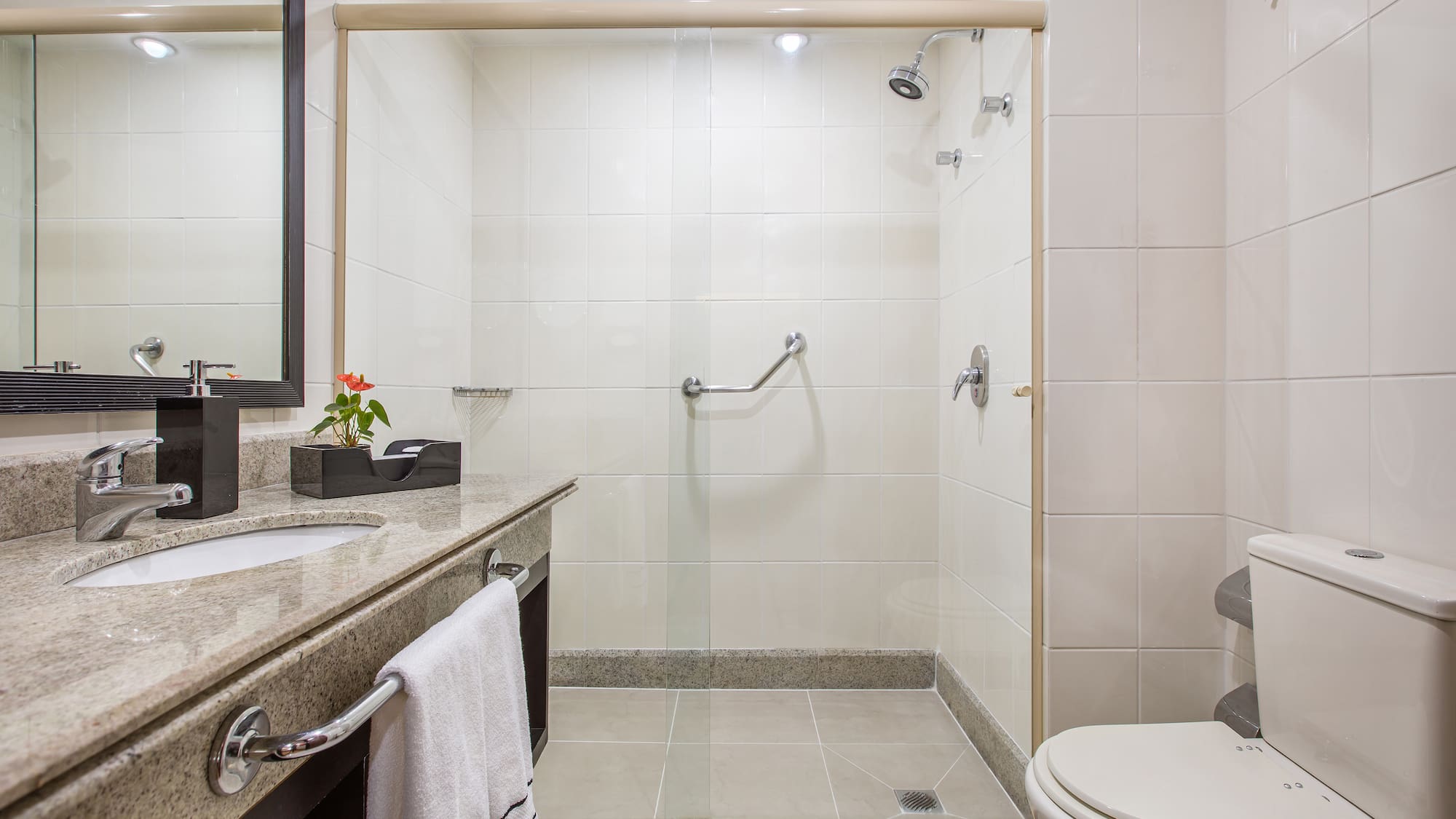 a bathroom with a shower and sink