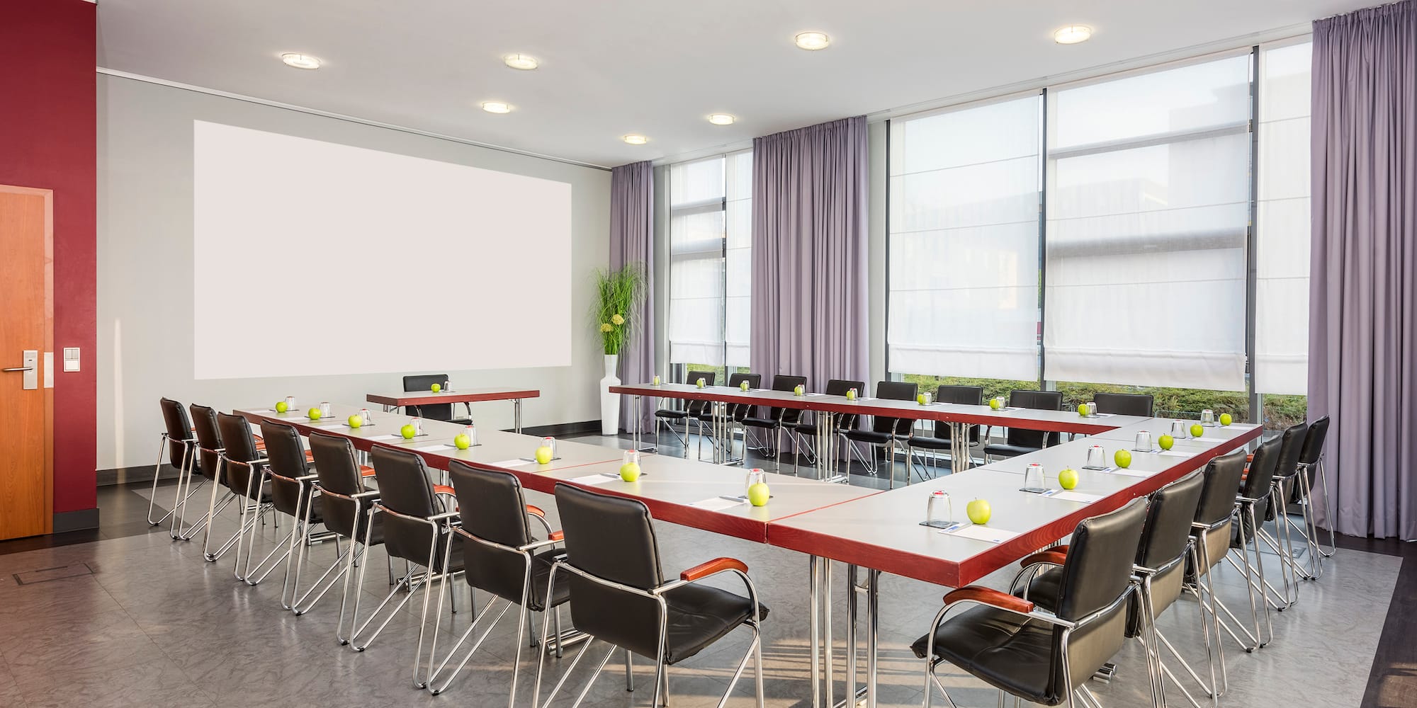 a room with a large table and chairs