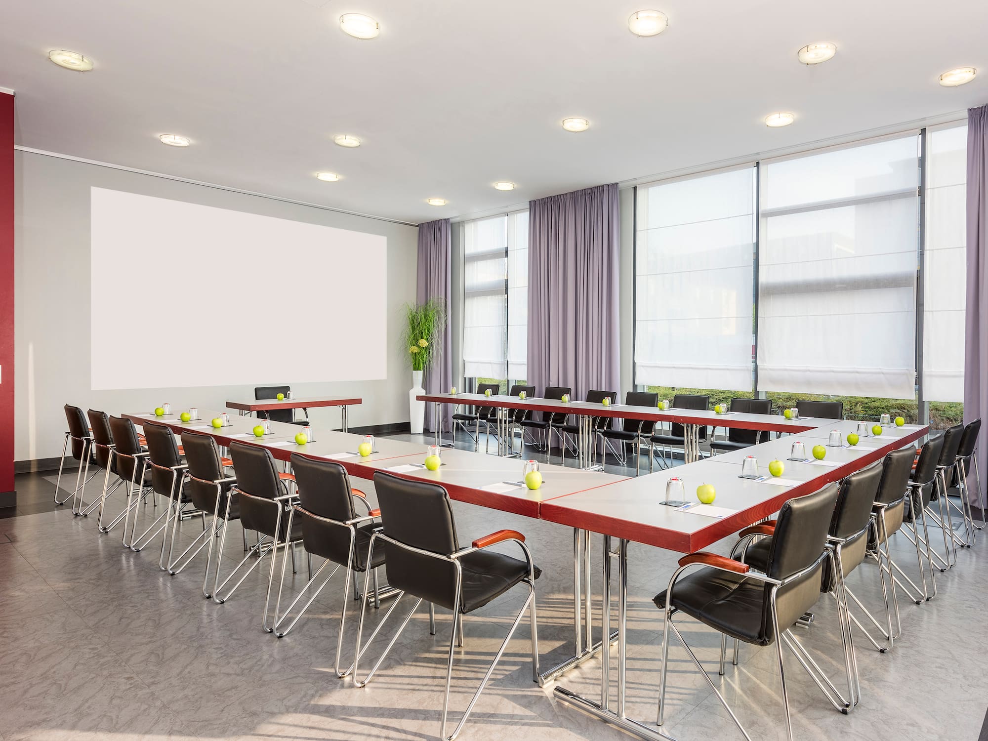 a room with a large table and chairs