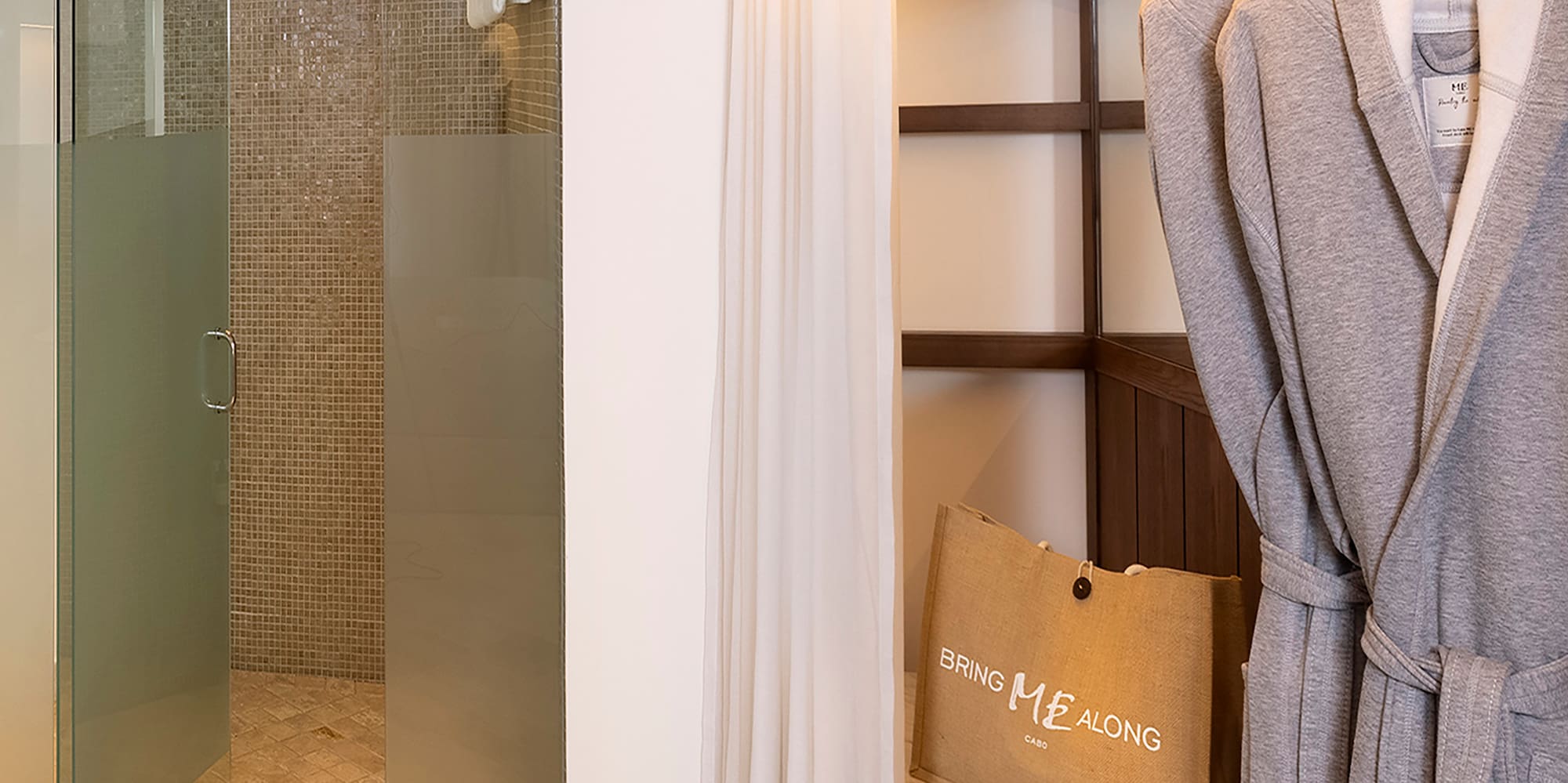 a bathroom with a shower and bathrobe