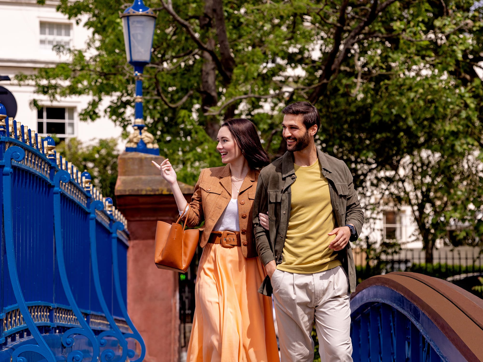 A group of individuals gathered in front of a big building.