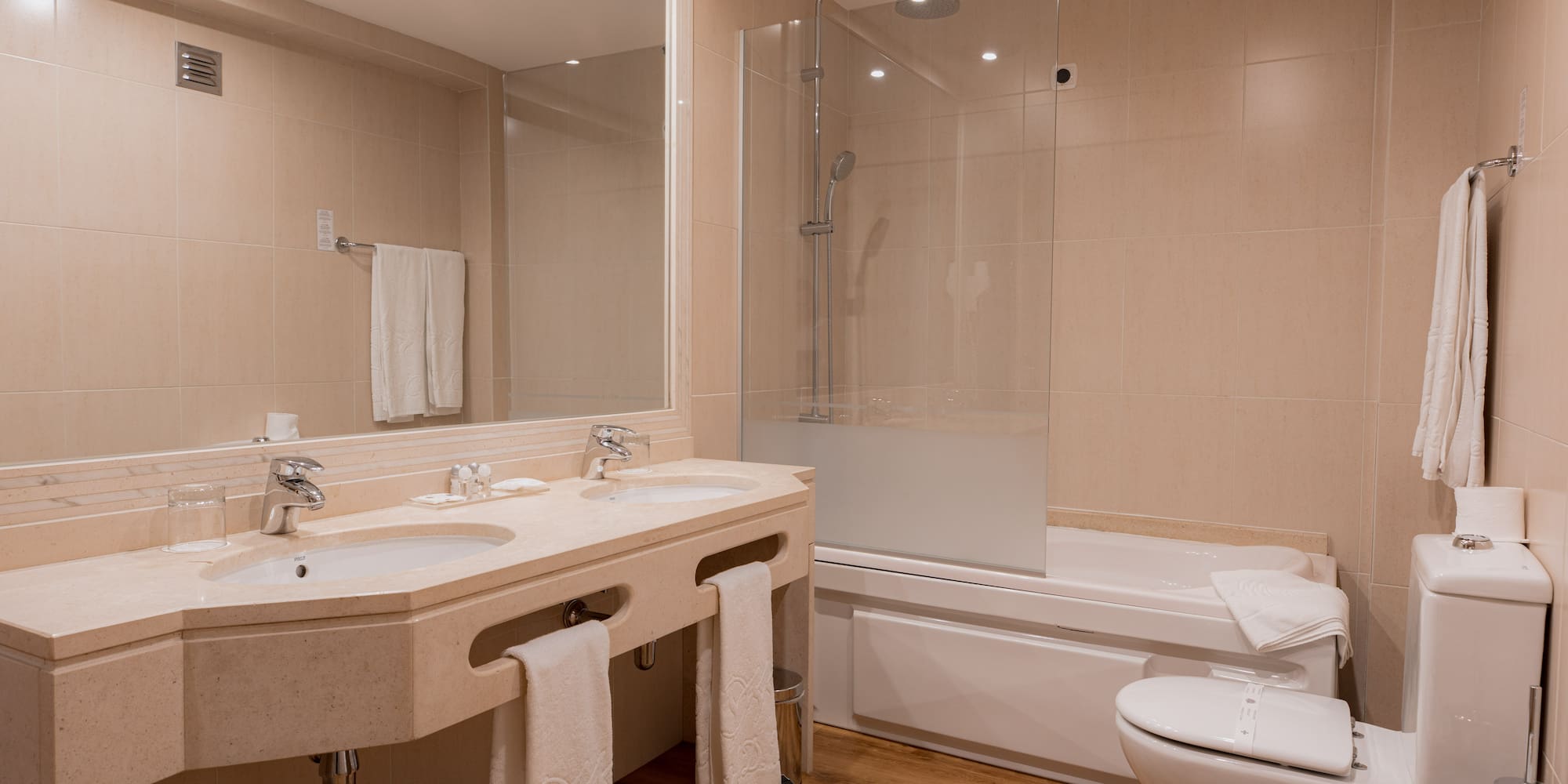 a bathroom with a shower and sink