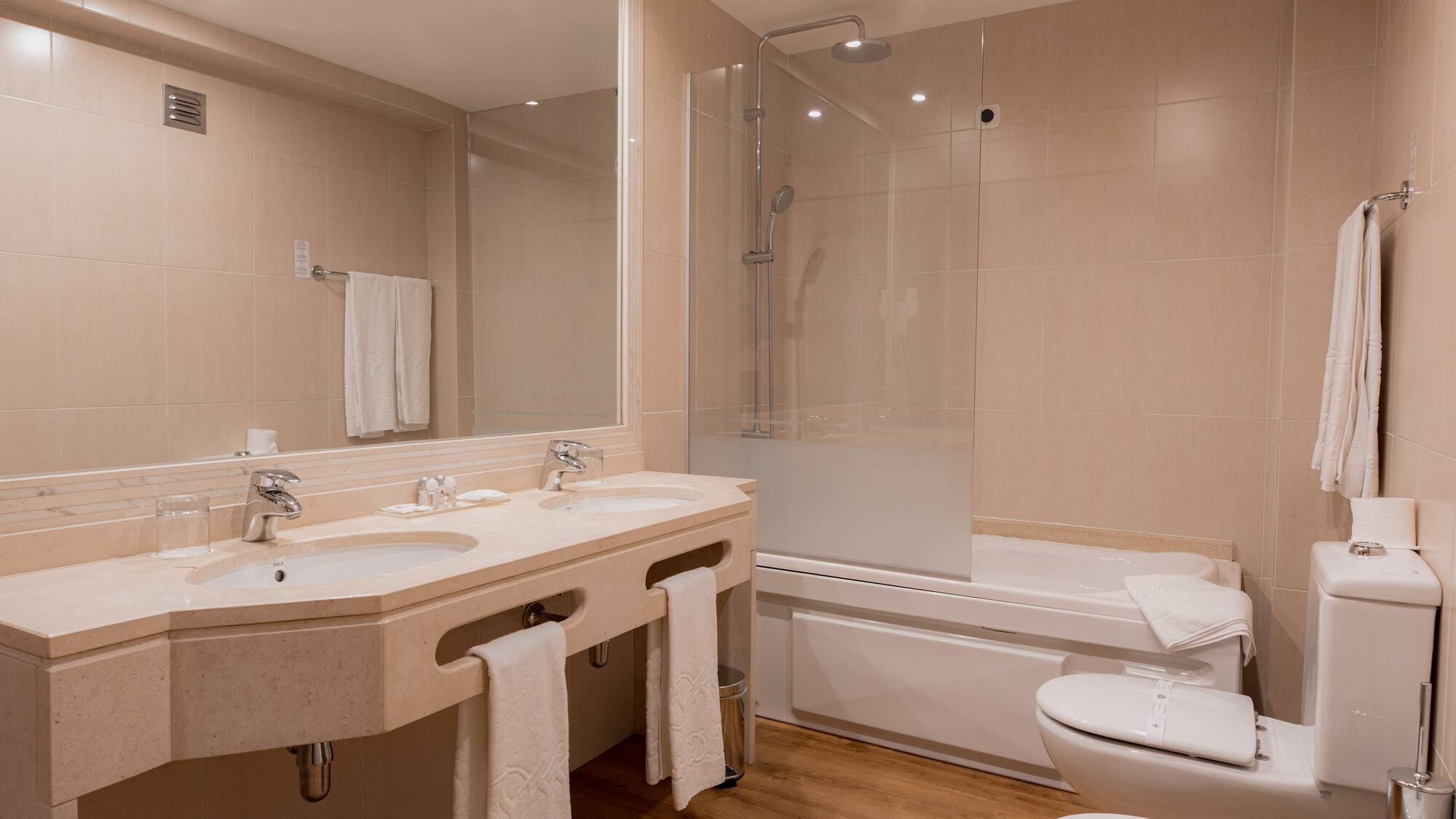 a bathroom with a shower and sink