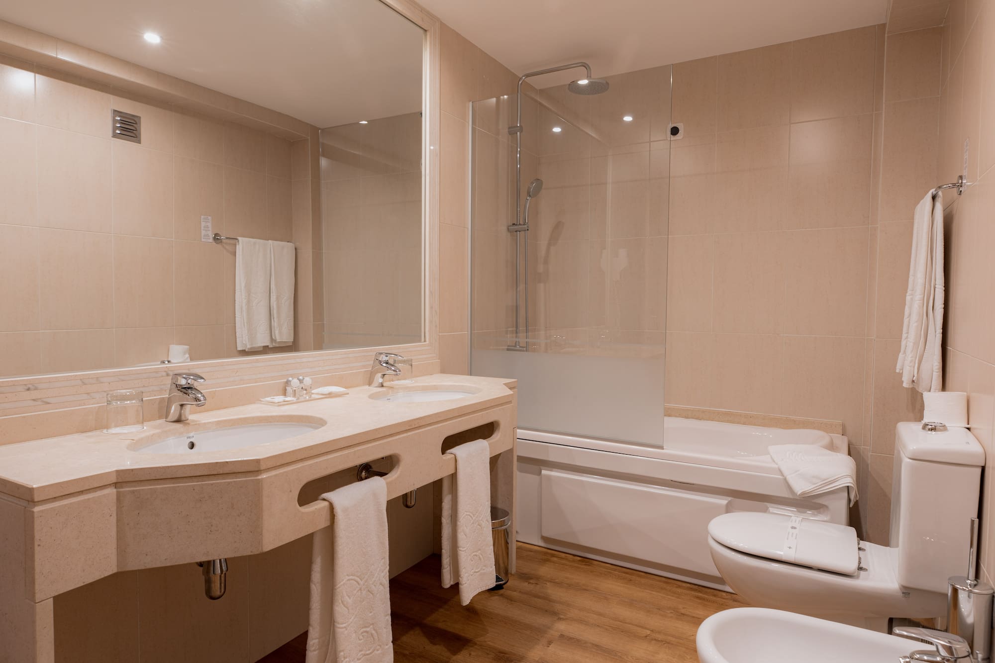 a bathroom with a shower and sink