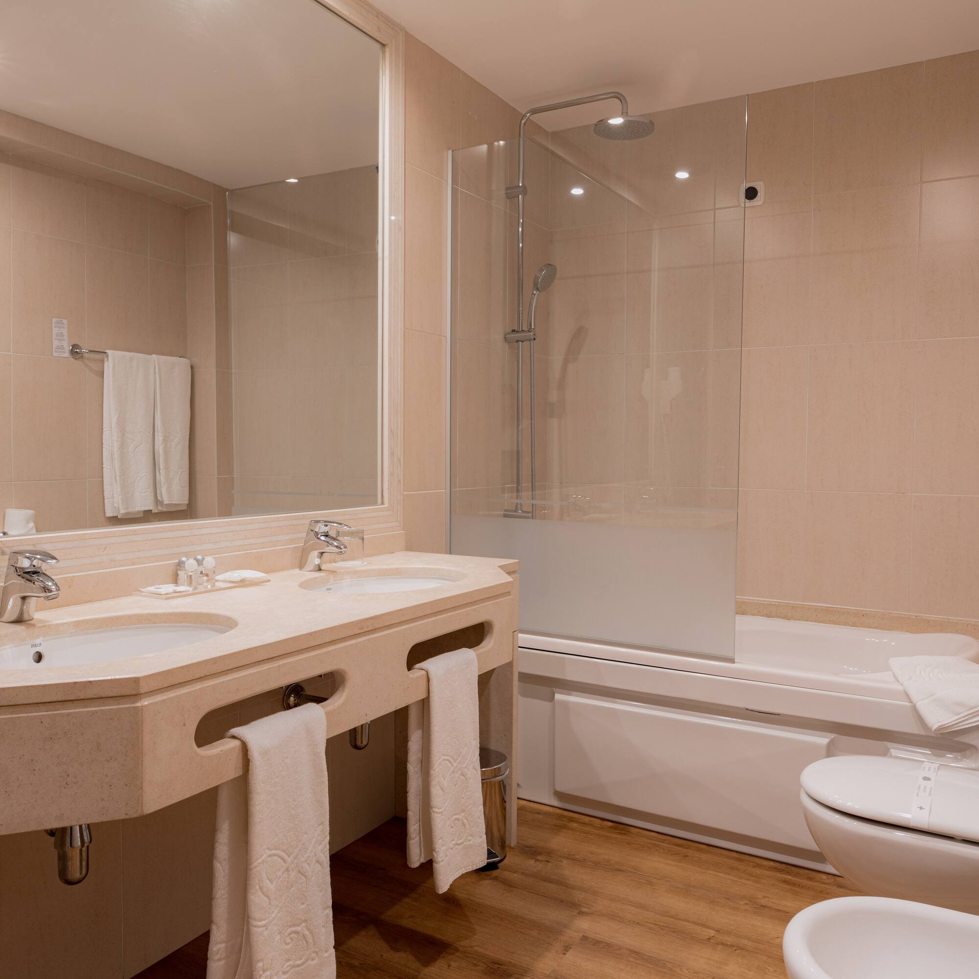 a bathroom with a shower and sink