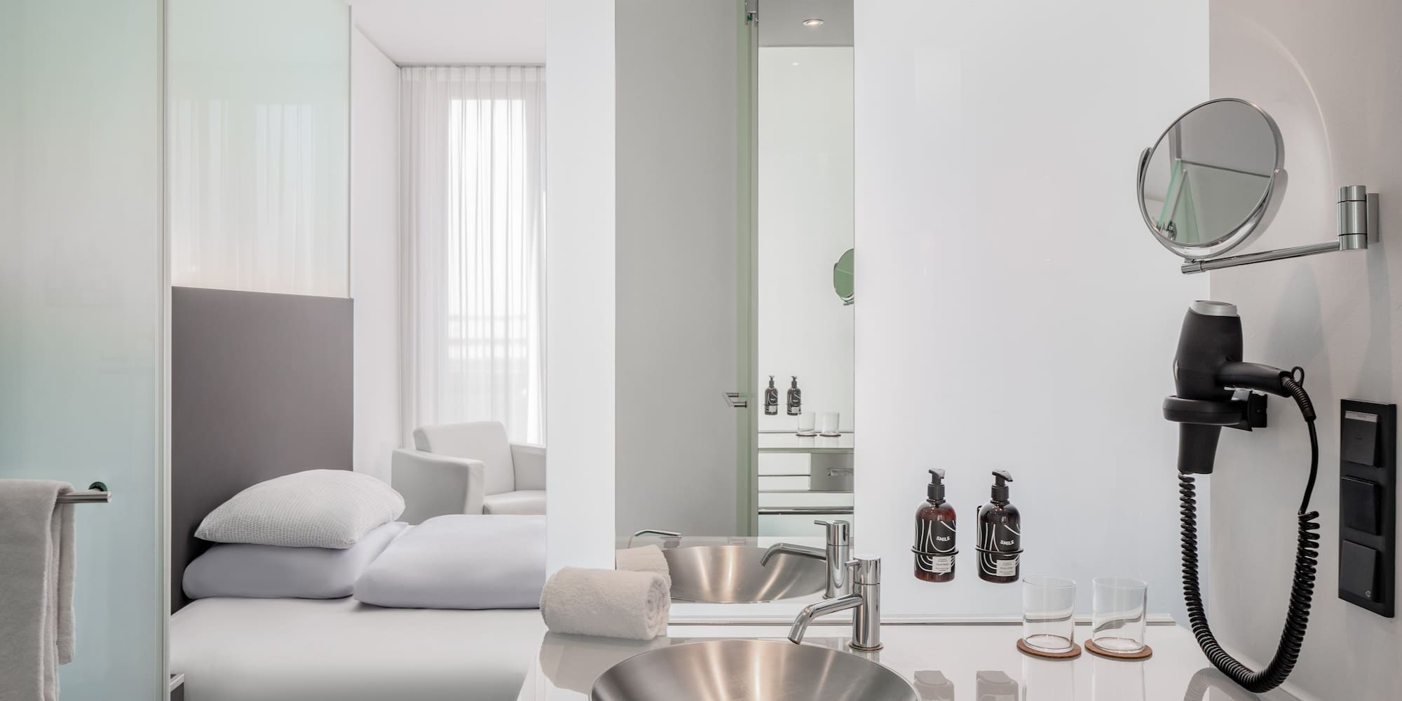 a bathroom with a mirror and sink