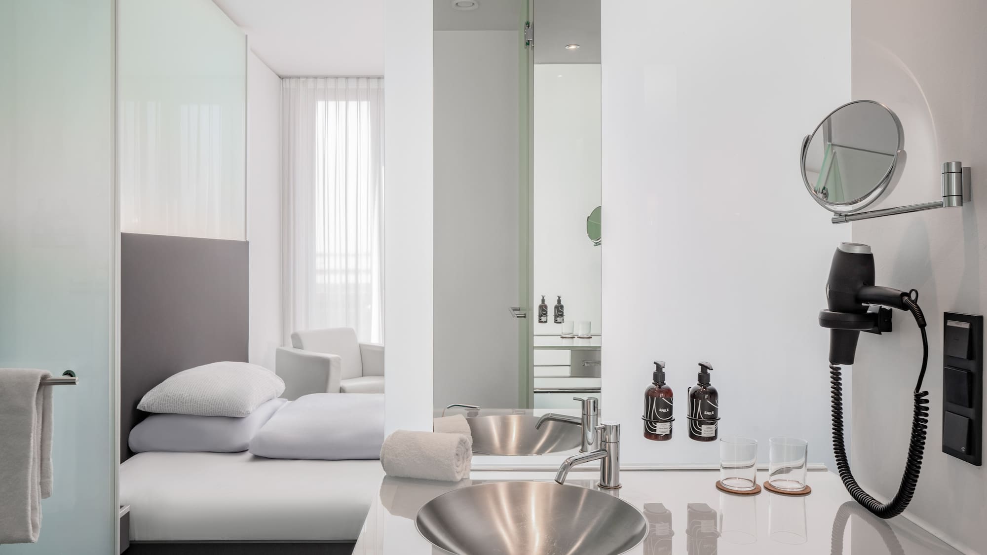 a bathroom with a mirror and sink