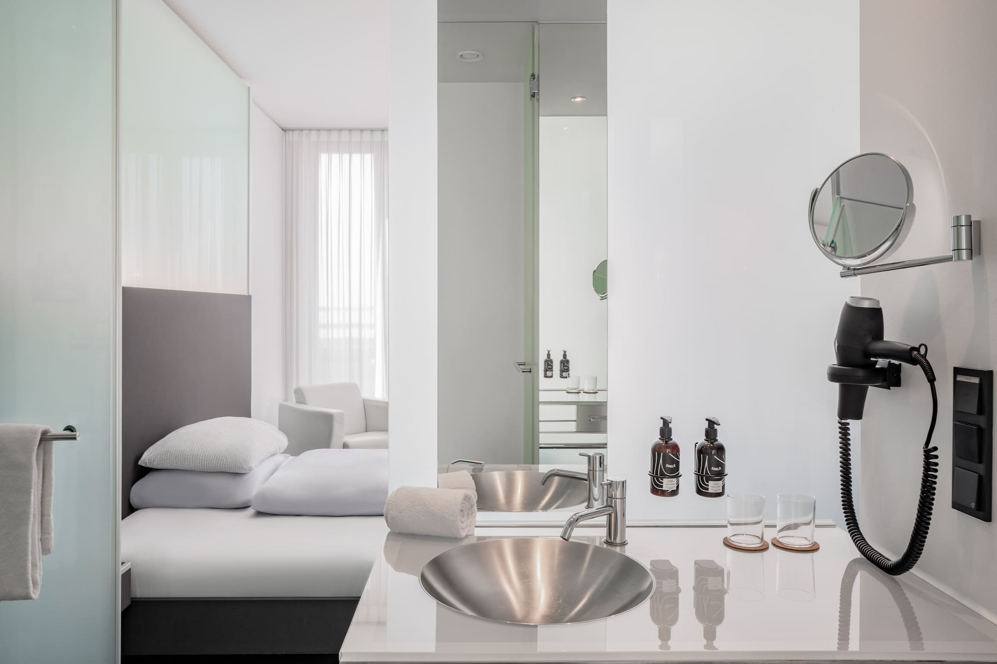 a bathroom with a mirror and sink