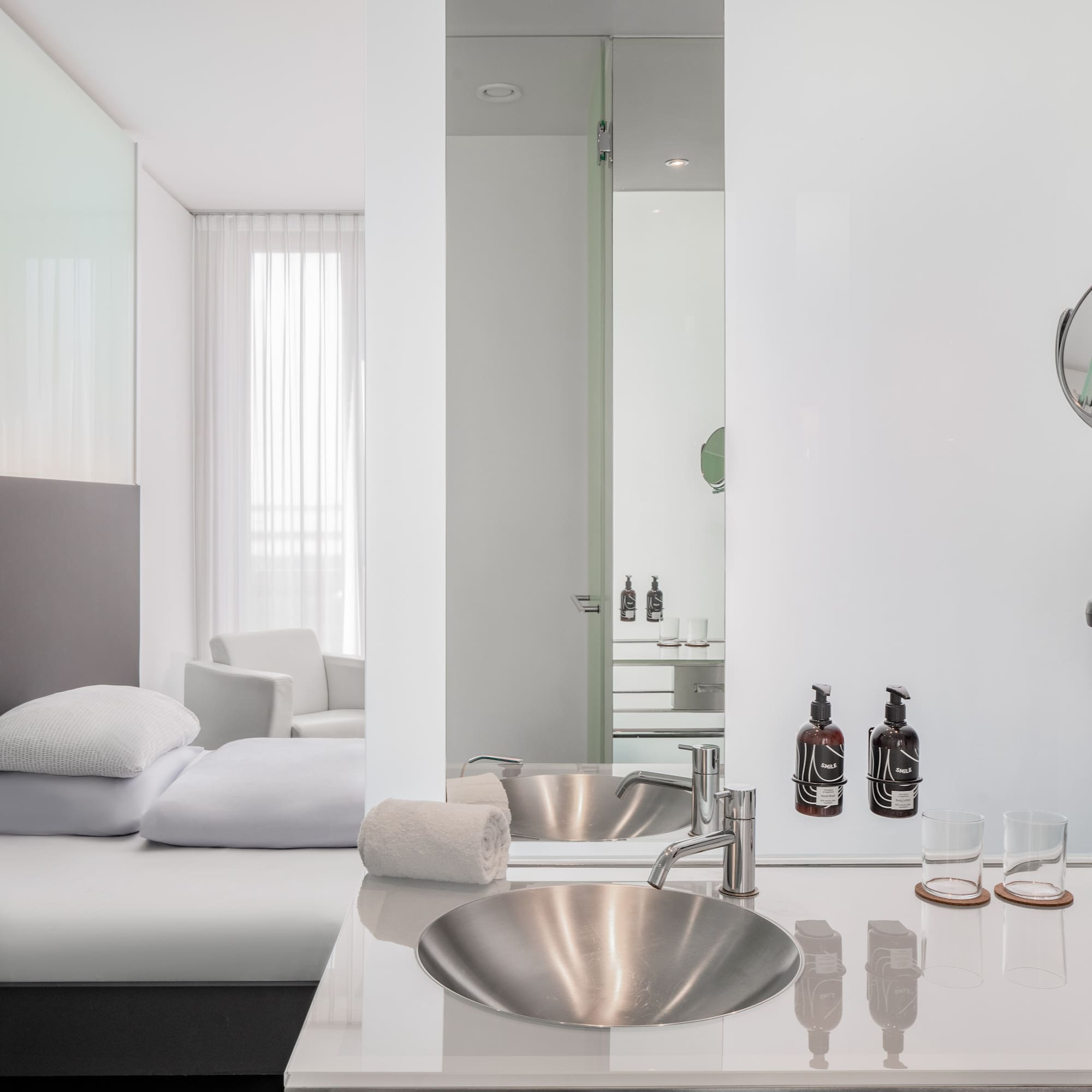 a bathroom with a mirror and sink