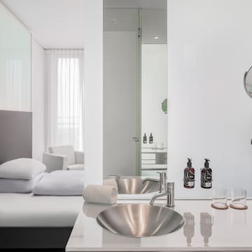 a bathroom with a mirror and sink