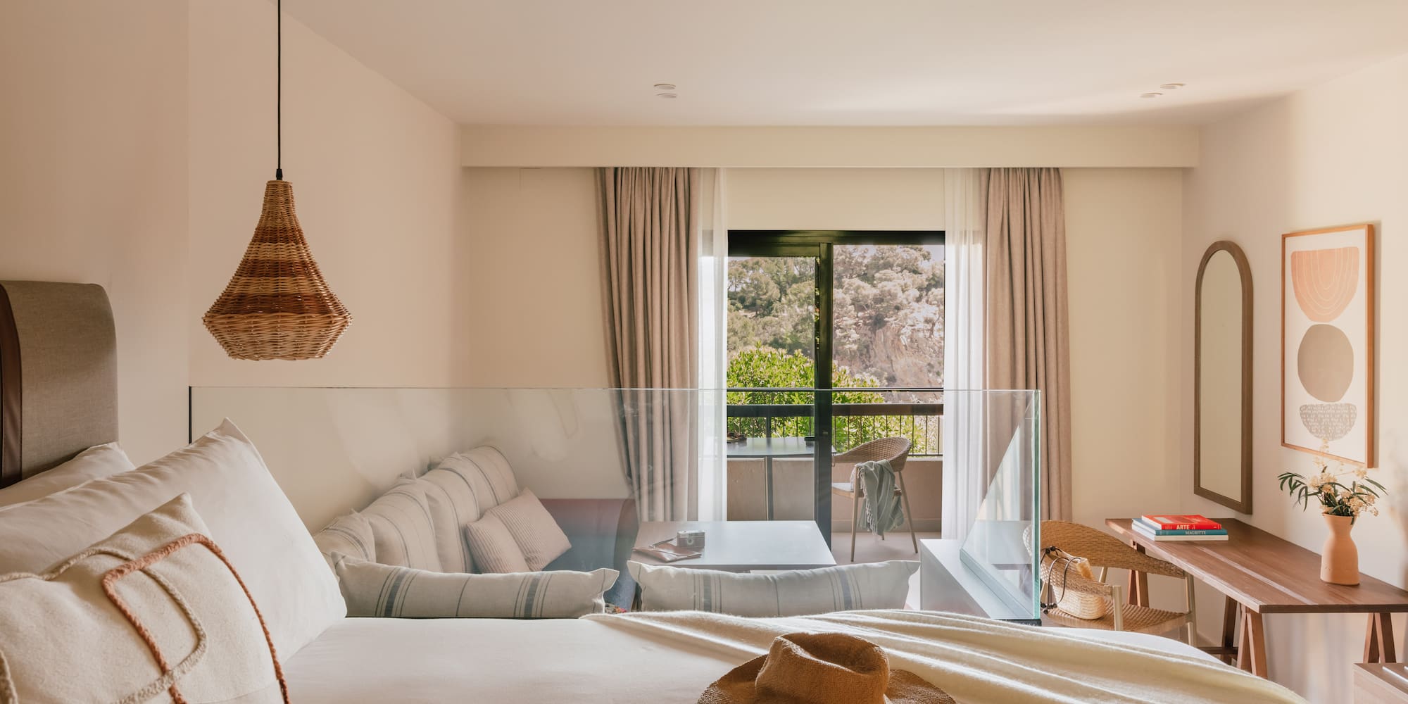 a room with a bed and a table and chairs