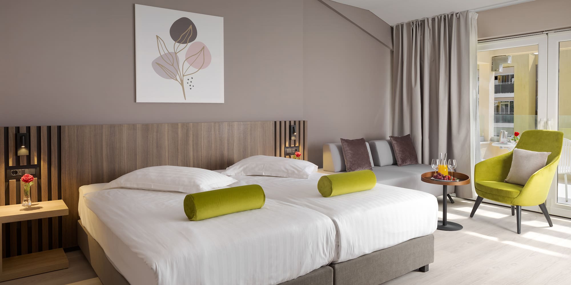 a room with two beds and a table